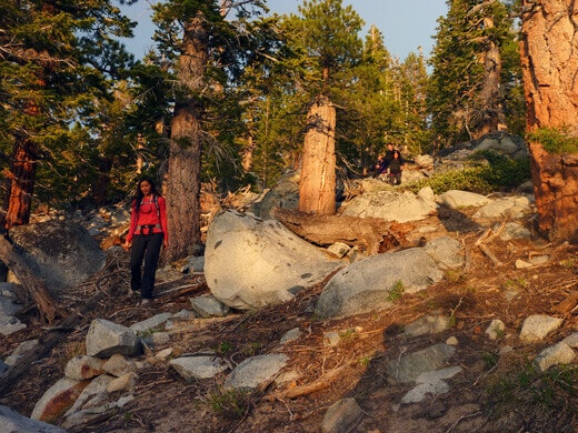Hiking cross-country down a dirt slope