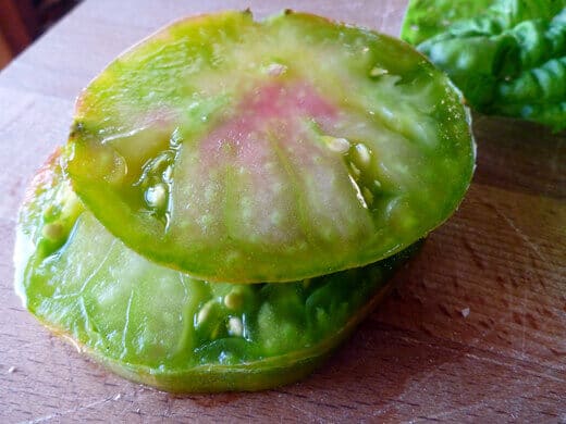 Thick, juicy slices of Ananas Noire heirloom tomatoes