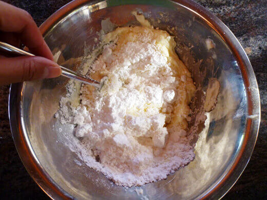 Combine softened butter, cream cheese, and powdered sugar