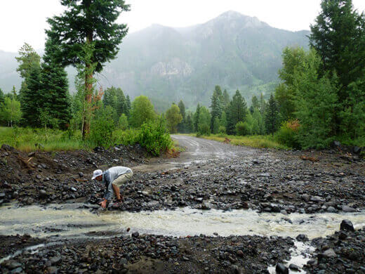 Rearranging rocks to ford the creek