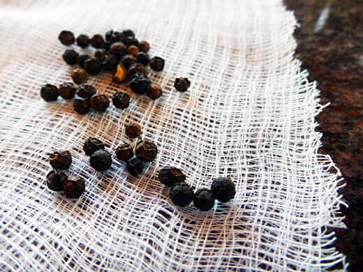 Whole black peppercorns