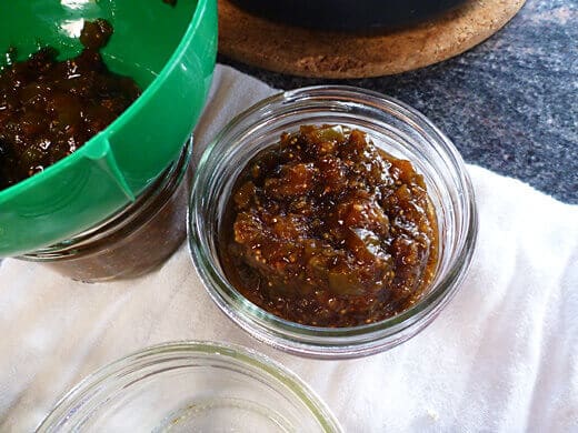 Ladle jam into hot sterilized jars
