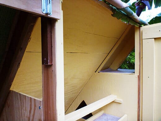 Two windows for cross-ventilation inside the coop