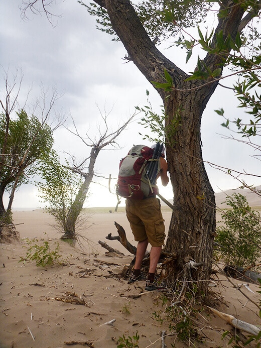 Taking cover during a Great Sand Dunes windstorm