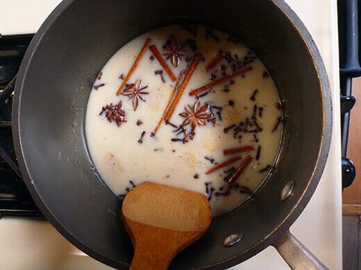 Combine heavy cream, milk, tea bags, ginger, chai spices, sugar, and salt over medium-low heat