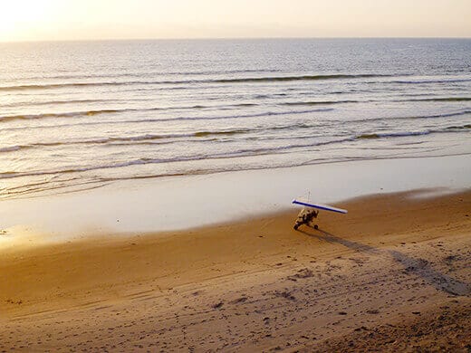 Ultralight taking off from the beach