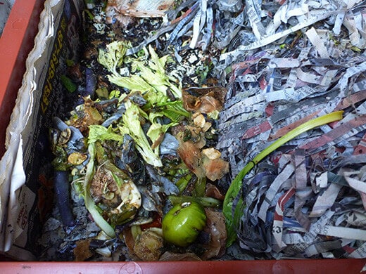 Adding another handful of scraps to the bin