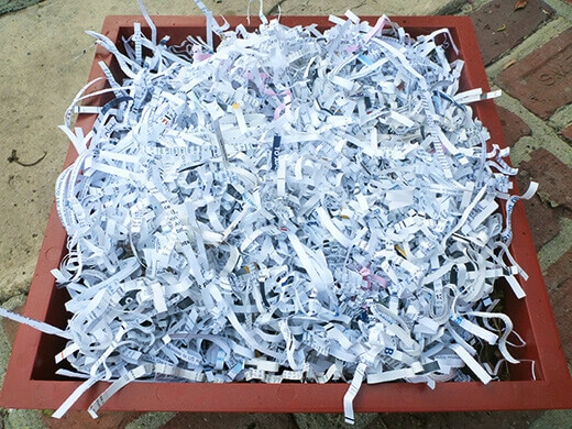 Top the layers with shredded paper