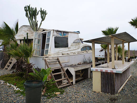 An old cabin cruiser turned surf shack