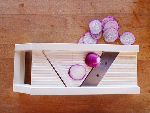 Thinly slice the radish using a mandoline