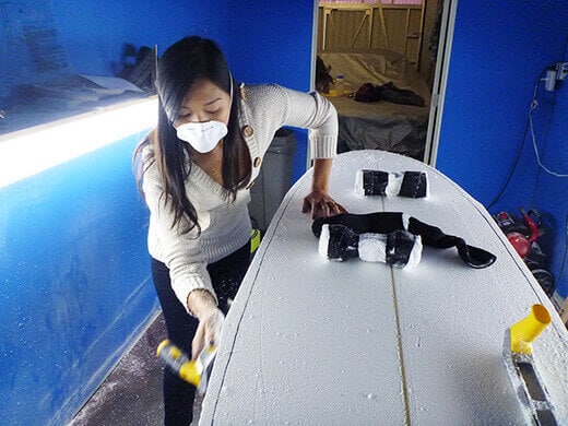 Shaving down the edges with a surform