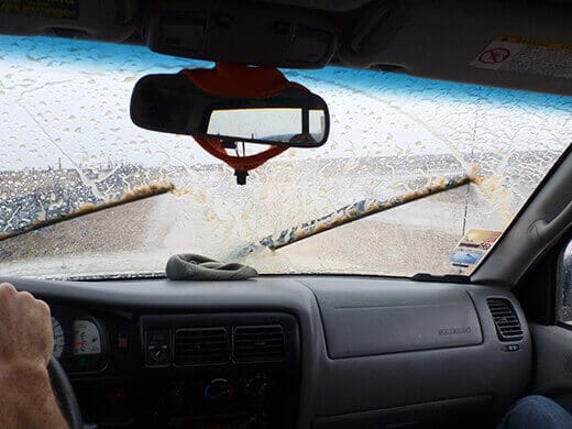 Wiping mud off the windshield