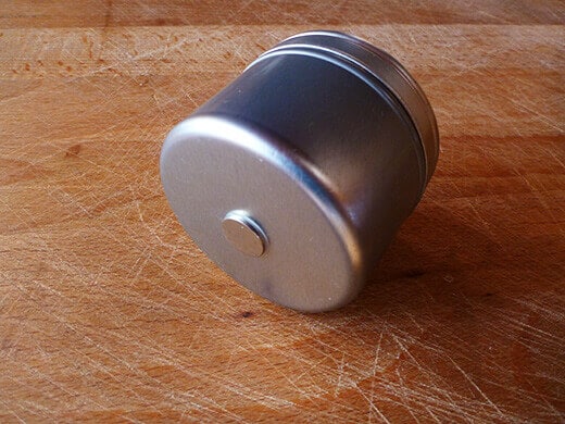 Glue rare earth magnets to tins using epoxy