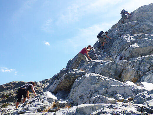 Climbing over a ridge to Iceberg Lake