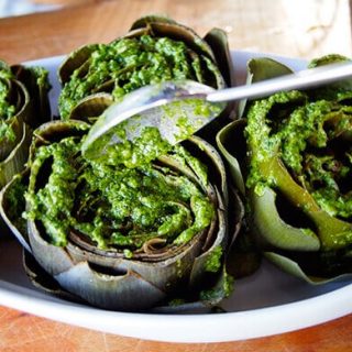 Pour pesto over the artichokes and into the crevices