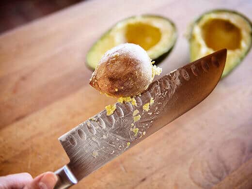 Slice avocado in half and remove the pit