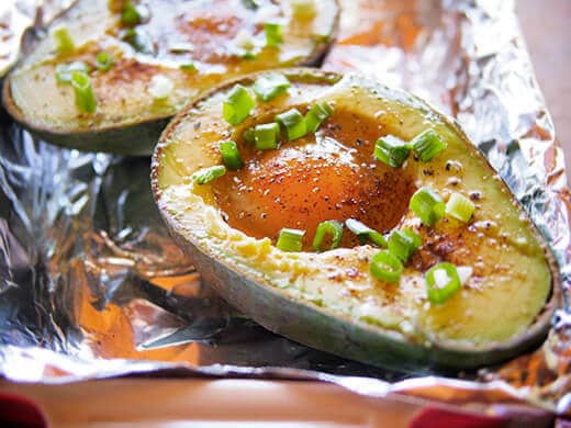 Crack an egg into the hollow and fill with spices