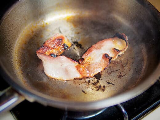 Fry bacon until crisp