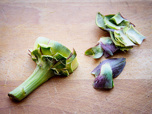 Pull off tough outer leaves by hand
