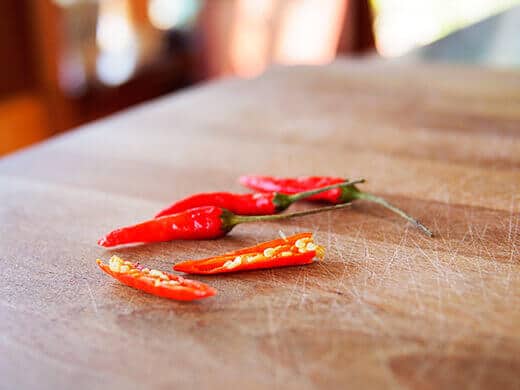 Split Thai bird's eye chili in half lengthwise
