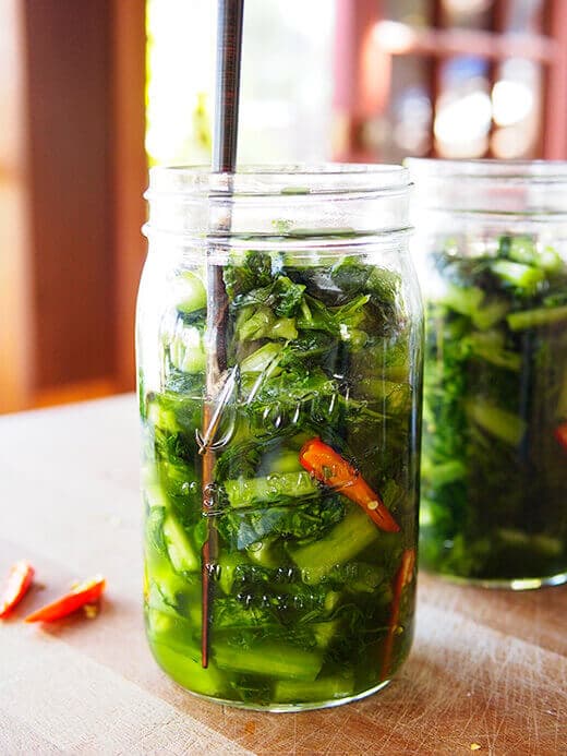 Run a chopstick around the jar to release trapped air bubbles
