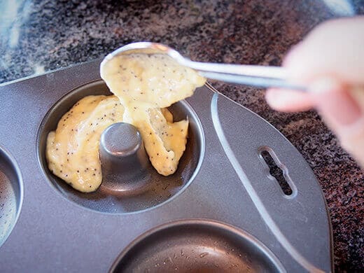 Fill donuts molds with lemon-poppy seed batter