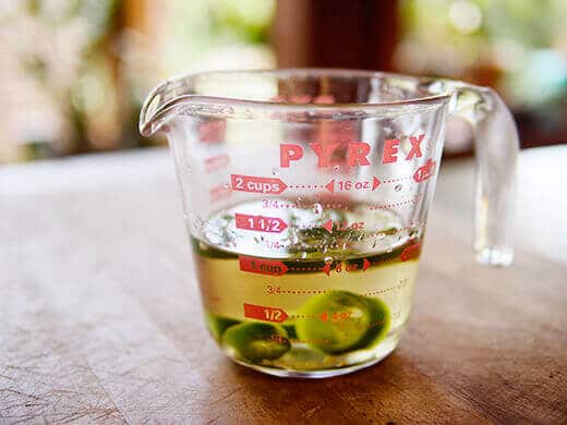 Steep jalapenos in tequila