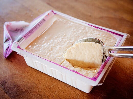 Scoop out tofu with a large spoon