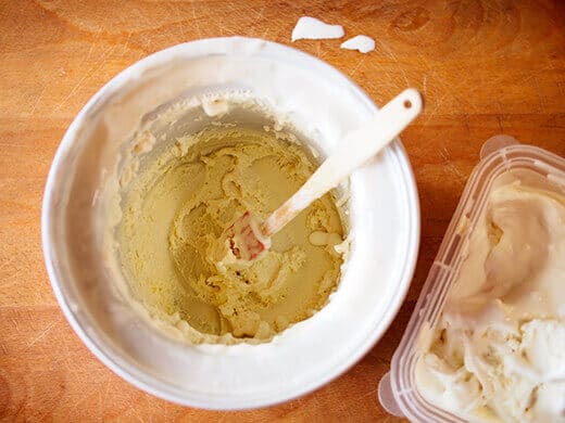 Scoop out freshly churned ice cream into a freeze-proof container