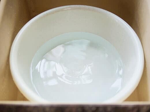 Fill a wash tub with warm water