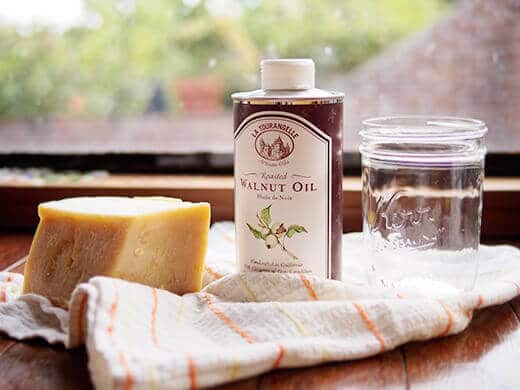 A block of beeswax and a bottle of walnut oil to make spoon butter
