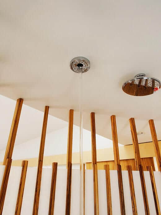 A column of water streaming out of a ceiling spout
