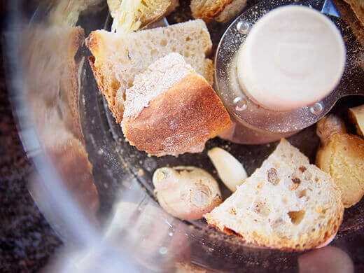 Add bread, ginger, and garlic to food processor