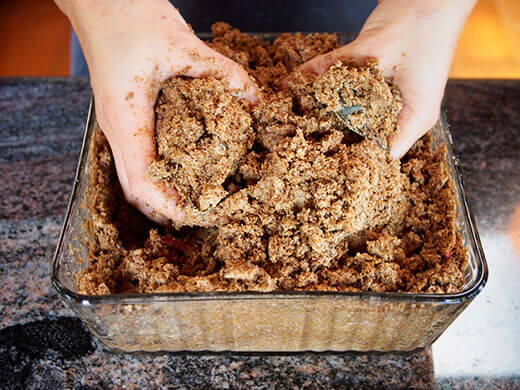 Stir up the nuka with your hands to aerate the bed
