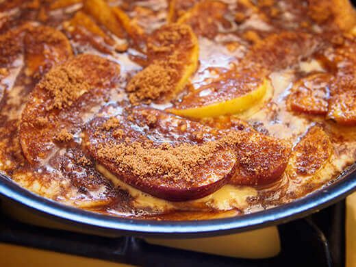 Pour batter over apples