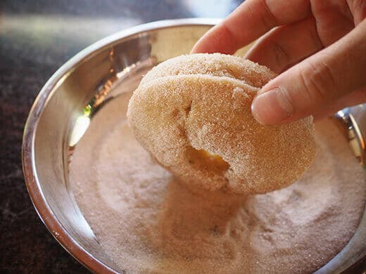 Dip donuts in cinnamon sugar