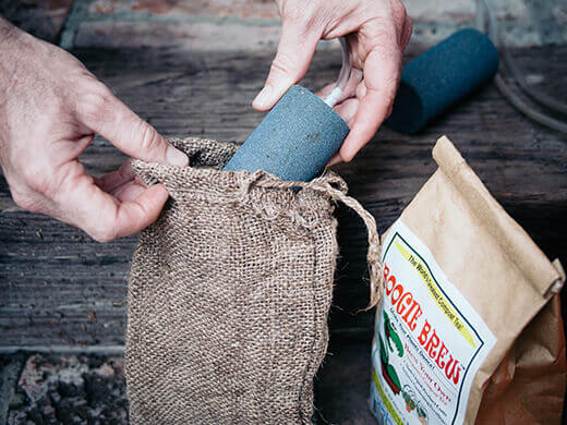 Place air stone in burlap sack