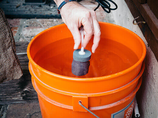 Place air stone in brewing bucket