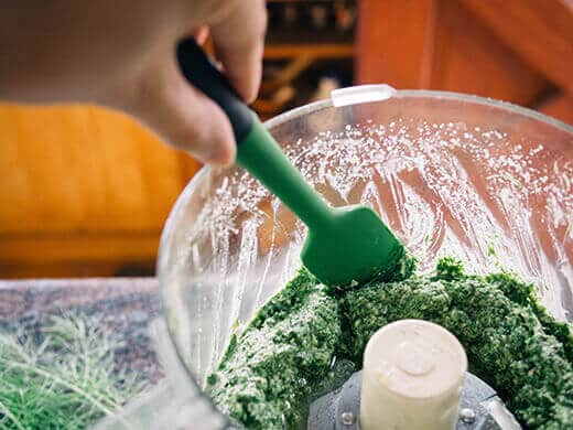 Scraping down the sides with a silicone spatula