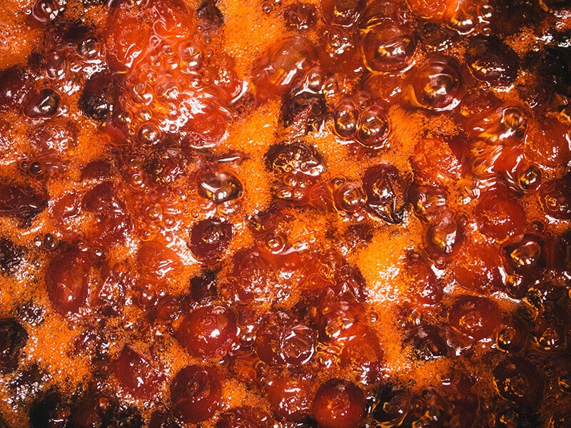 Cook cranberries until they burst