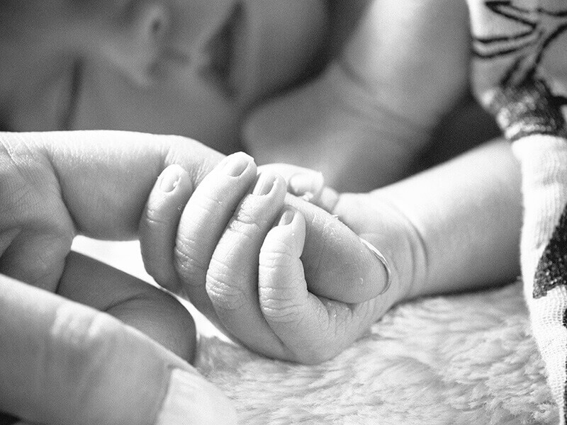 Delicate newborn fingers
