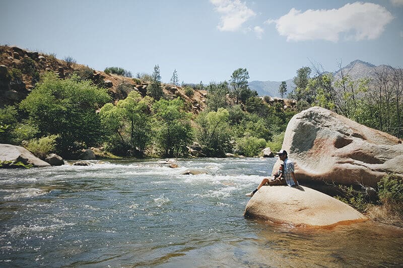 Pop and tot on a rock