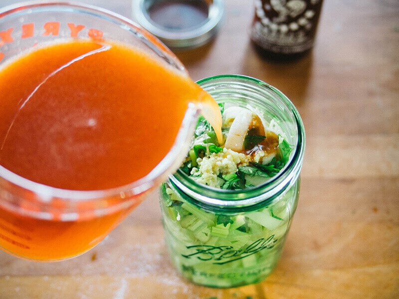 Pour in sriracha pickling brine