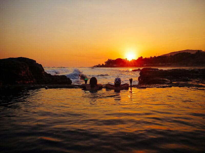 Soaking at sunset with friends