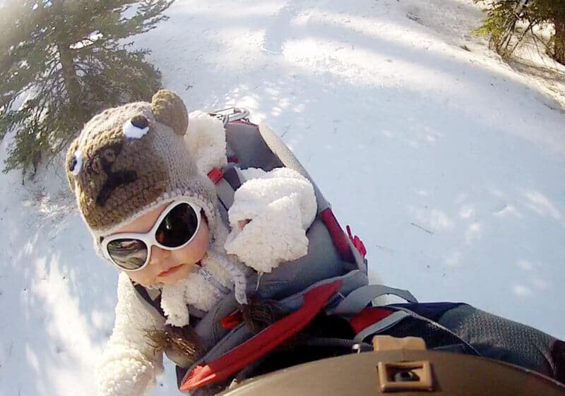 Wearing a one-piece fleece suit and sunglasses