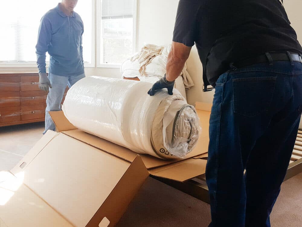 An Avocado mattress arrives tightly compressed, folded, rolled, and wrapped in box