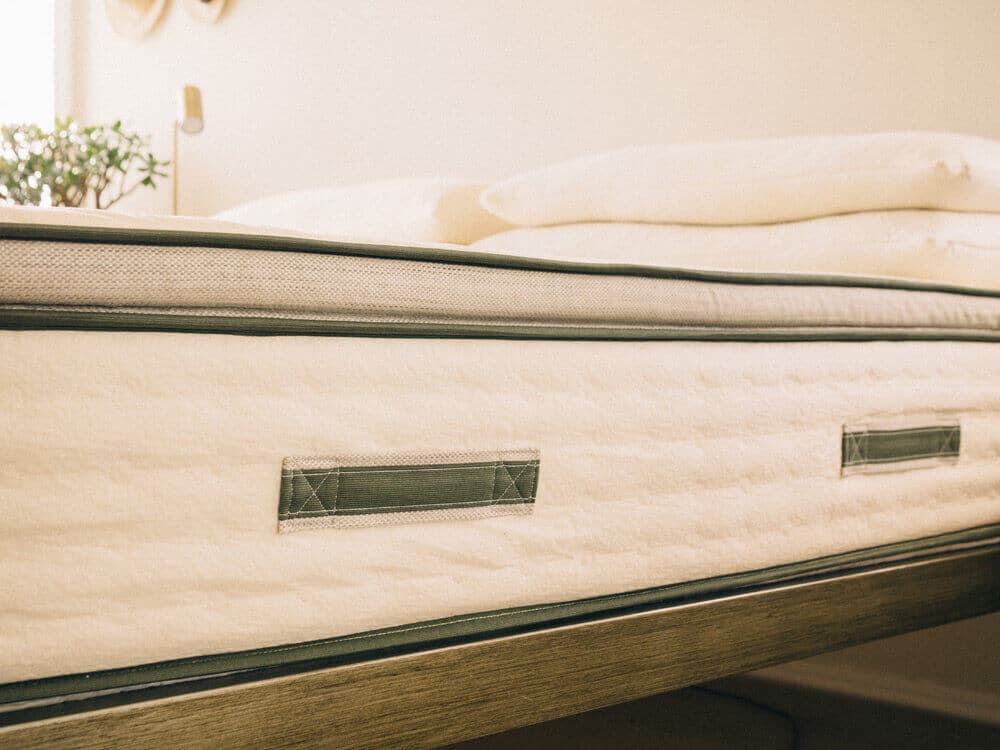 Upholstered side handles allow for easy moving