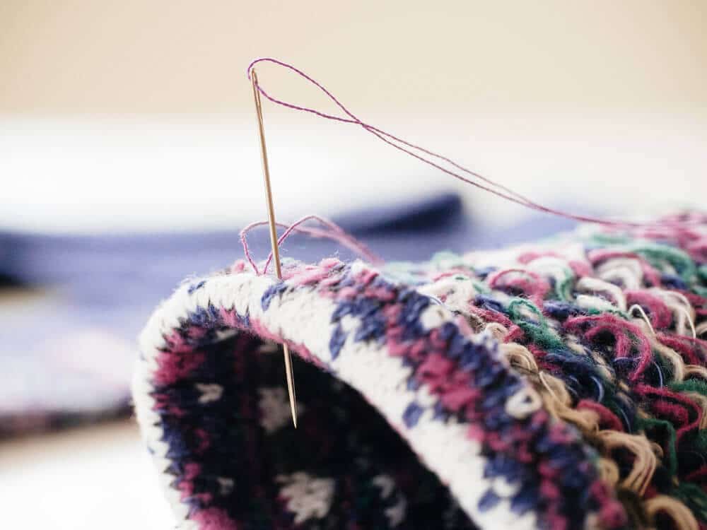 Hand stitch the raw edge of the sock