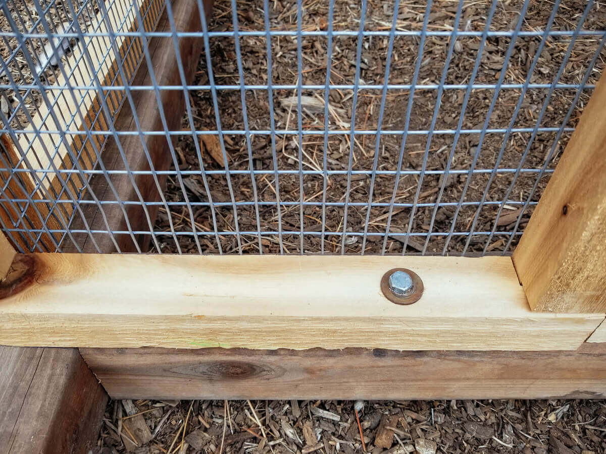 Bolting the chicken coop onto the tractor frame
