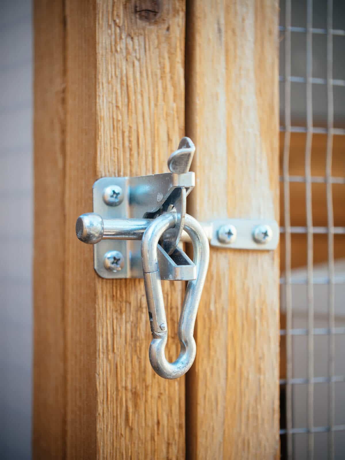 Gate latch secured with spring link